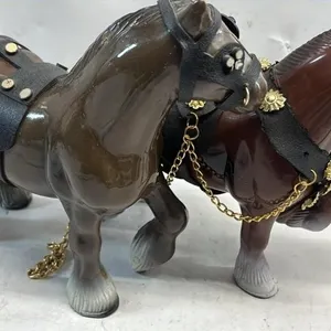 Two plastic Clydesdale horses