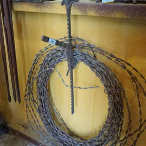Old Fence Stretcher and Barbed Wire