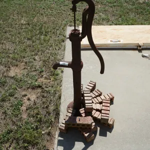 Dempster Mill Old Hand Water Pump #216 and Brick