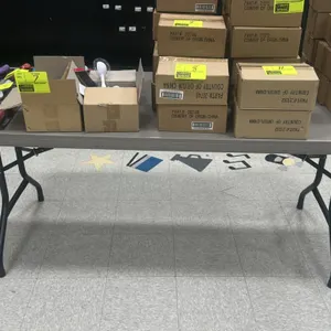 Poly folding utility table. Features a gray polyethylene tabletop and folding metal legs. 6'L. Contents not included.