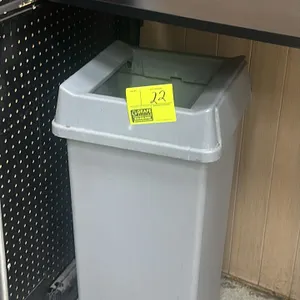 Poly trash bin. Features gray molded plastic construction with a rectangular profile and a drop-in open-top lid.