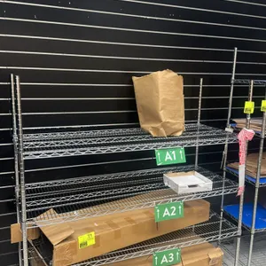Metro-style wire shelving racking unit. Features four adjustable wire shelves with a chrome finish. Dimensions: 5'L x 1.5'W x 5.5'H. Contents and boxe