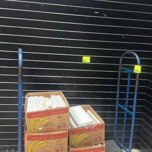 Unbranded metal U-boat utility cart. Features blue painted steel frame construction with a diamond plate deck and two high end-handles. 4'L. Mounted o
