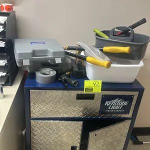 Assorted tool lot with rolling utility cabinet. Includes a Keystone Light branded 1-drawer, 2-door mobile metal cabinet on casters, an ACDelco 18V cor