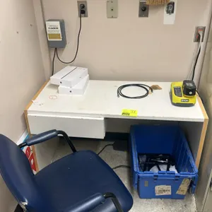 Laminate desk with faux leather chair. Desk features a white laminate top with wood-look edge banding and a single drawer. Chair features blue faux le