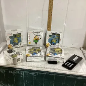 BOX OF MINION TOYS, NAIL CLIPPERS, SMART CLOUD CAMERA