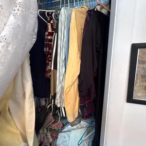 CLOSET OF MEN'S CLOTHING