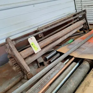 Metal Roller and Assorted Metal Parts in Back of Room