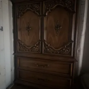 Wooden Armoire With Carved Detail