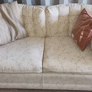 Two Seat Sofa with Beige Upholstery and Pastel Flowers