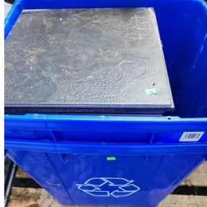 Ceramic Floor Tiles and Blue Recycling Bins