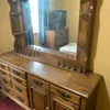 Wooden Dresser with Attached Mirror and Decorative Accents