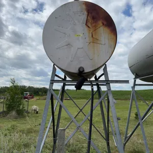 Cylindrical metal fuel  tank mounted on a metal stand, suitable for fuel or 