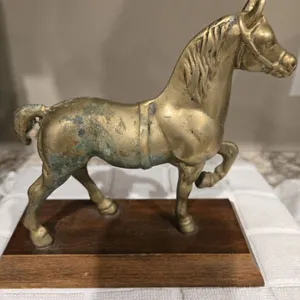 49 - Vintage solid brass horse statue on wood base. 6 1/2" tall includes base.