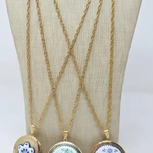 Three Gold Tone Lockets on Chains