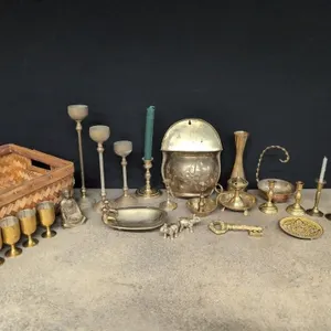 Brass candle holders, trays, vases, and statuettes