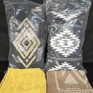 Two throw pillows that look brand new, like-new
