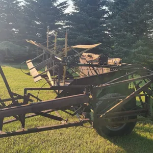 OFFSITE - Antique Pull type swather. Canvas and extra cutter bar.