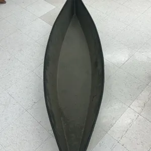Pirogues 78" poly canoe. Features an olive drab exterior with a textured interior. Open hull design without seats or bracing. 78"L.