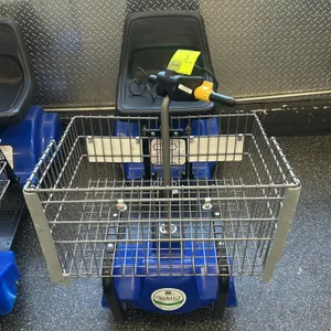 Mart Cart Model 63 battery-powered automatic shopping cart. Features a blue plastic shroud, front wire shopping basket, and textured black seat. Equip