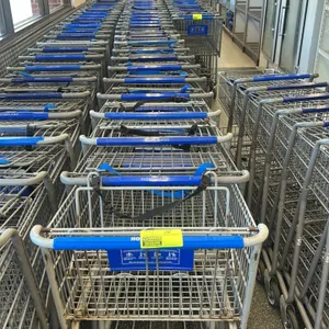 Full-sized metal wire shopping cart. Features a blue plastic handle wrap, a folding child seat with a safety strap, and a lower wire shelf. Mounted on