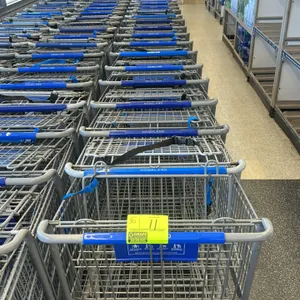 Metal wire shopping cart. Features a gray finish, blue plastic handle, integrated child seat with safety strap, and a lower wire storage tray. Mounted