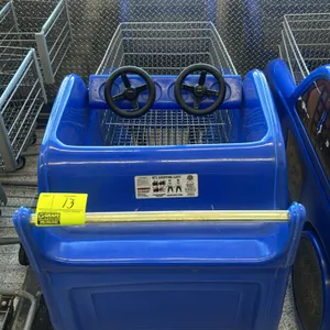 RTS Retail Kiddie Racecart shopping cart. Features a blue molded plastic race car body with number 05 graphics, double toy steering wheels, and dual s