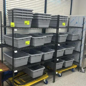 Metal multi-tier wire shelving rack. Features black wire construction with 4 adjustable shelves. Dimensions: 48"W x 24"D x 72"H. Stationary feet. Note
