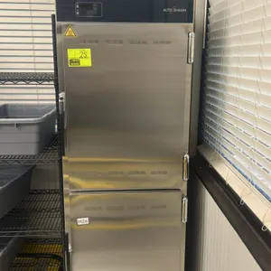 Alto-Shaam mobile heated holding cabinet. Features stainless steel construction, a 2-door split design, and a digital control panel. Upper compartment