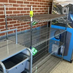 Stainless steel multi-tier wire shelving rack. Features 4 adjustable wire shelves on post uprights. 60"x23"x63". Equipped with leveling feet. Note: Gr