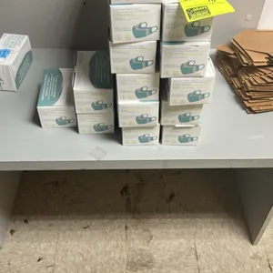 Laminate desk. Features a light gray laminate finish and panel leg base. Worksurface features a clipped right-front corner. 53"x24". Contents not incl