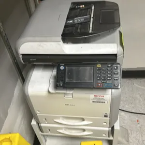 Ricoh MP 401 black and white laser multifunction printer. Features an automatic document feeder, adjustable touchscreen control panel, and dual paper 