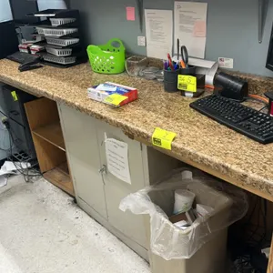 Unbranded 8'L laminate countertop. Features a brown faux-stone patterned finish. Note: Countertop only; underlying cabinetry, shelving, support struct
