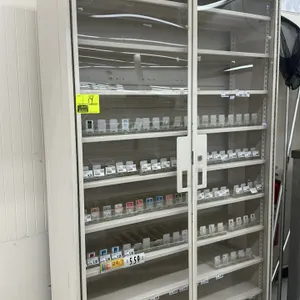 Lockable tobacco merchandiser cabinet. Features double sliding glass doors, adjustable metal shelving, and plastic product pushers/dividers. Dimension