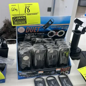 Vertigo by Lotus Duet dual cigar cutters. Features a combination V-cutter and guillotine cutter design in a single unit. Accommodates up to a 56 ring 
