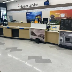 Laminate customer service counter. Features a curved modular design with integrated under-counter storage, drawers, cabinets, and open shelving. Inclu