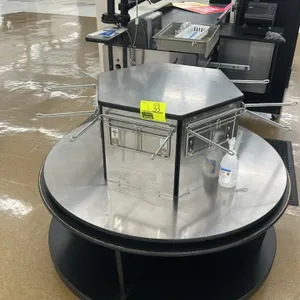 11'L grocery check lane counter. Features an integrated 4' conveyor belt, stainless steel and laminate construction, and a rotating bagger stand with 