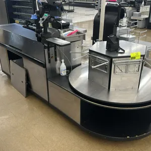 Check lane counter. Features an 11'L counter with a 4'L conveyor belt and a stainless steel top laminate rotating bagger stand with wire bag hangers. 