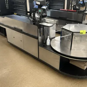 Check lane counter. Features an 11' overall length, a 4' conveyor belt, and a rotating bagger stand with a stainless steel top laminate. Constructed w