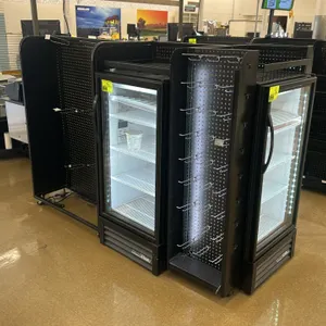 Unbranded candy and magazine retail display racking. Features black metal construction, pegboard back panels, wire magazine racks, candy shelving hook