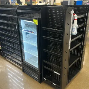 Candy and magazine display racking. Features integrated LED lighting, wire shelving, and pegboard backing. 81"x36"x60". Note: Refrigerator, spray bott