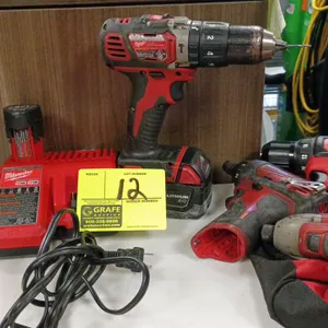 Milwaukee power tool assortment. Includes (1) M18 drill/driver with (1) M18 RedLithium XC battery, (1) M12/M18 multi-voltage battery charger, (1) M12 