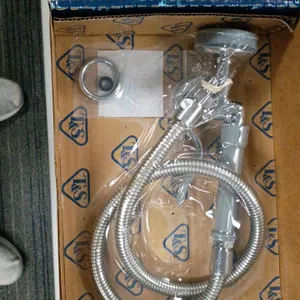 T&S Brass B-0100 pre-rinse spray valve assembly. Features a flexible stainless steel hose, spray valve head, and grip handle. Includes original box, i