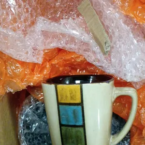 Assorted mugs, printing calculator, and tea serving set. Includes a 12-digit electronic printing calculator with clock and calendar functions, assorte
