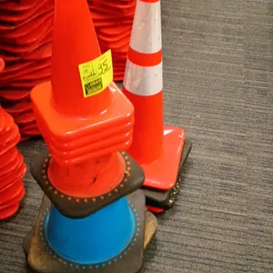 13-piece assortment of traffic safety cones. Includes standard orange cones, a tall orange cone with dual reflective silver bands and a black weighted