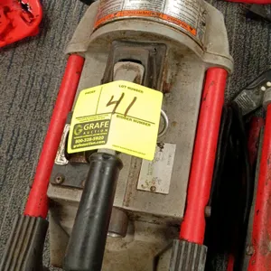 RIDGID K-60SP compact sectional drain cleaning machine. Features a forward/reverse switch and integrated carrying handle. S/N: VAS570800619. Electrica