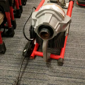 RIDGID K-60SP compact sectional drain cleaning machine. Features a durable protective frame and integrated carrying handle. Electrical: 120V, 60 Hz, 7