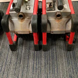 RIDGID K-60SP compact sectional drain cleaning machine. Features a forward/off/reverse switch, clutch handle, and side carrying handles. Designed for 