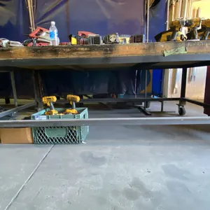METAL FRAMED WOOD TOP LARGE MOBILE SHOP TABLE APPROX 8'L X 4'D X 2' 11"H