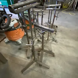 GROUP OF APPROX 10 METAL MATERIAL ROLLER STANDS
